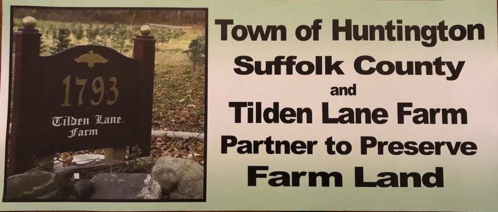 A Banner reading "Town of Huntington Suffolk County and Tilden Lane Farm Partner to Preserve Farm Land". To the left is a photograph of TLF's sign.